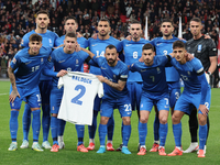 The Greece team poses for a photo. In the back row are Ninos Mavropanos (West Ham United), Tasos Bakasetas (Panathinaikos), Vangelis Pavlidi...