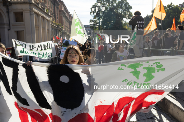 Protesters participate in the climate protest ''Fridays For Future'' in Turin, Italy, on October 11, 2024. The Fridays for the Future moveme...