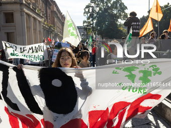 Protesters participate in the climate protest ''Fridays For Future'' in Turin, Italy, on October 11, 2024. The Fridays for the Future moveme...