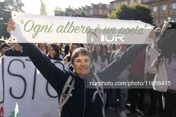 Protesters participate in the climate protest ''Fridays For Future'' in Turin, Italy, on October 11, 2024. The Fridays for the Future moveme...