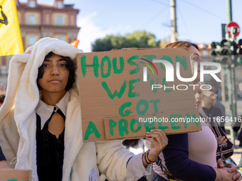 Protesters participate in the climate protest ''Fridays For Future'' in Turin, Italy, on October 11, 2024. The Fridays for the Future moveme...