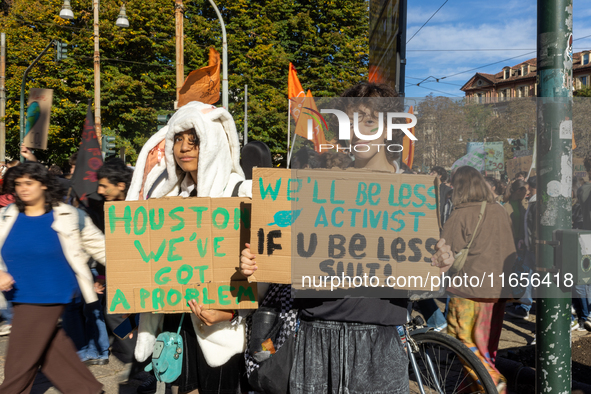 Protesters participate in the climate protest ''Fridays For Future'' in Turin, Italy, on October 11, 2024. The Fridays for the Future moveme...