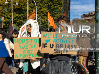 Protesters participate in the climate protest ''Fridays For Future'' in Turin, Italy, on October 11, 2024. The Fridays for the Future moveme...