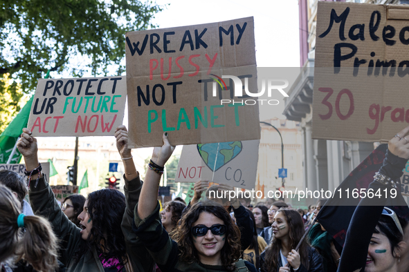 Protesters participate in the climate protest ''Fridays For Future'' in Turin, Italy, on October 11, 2024. The Fridays for the Future moveme...