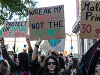 Protesters participate in the climate protest ''Fridays For Future'' in Turin, Italy, on October 11, 2024. The Fridays for the Future moveme...