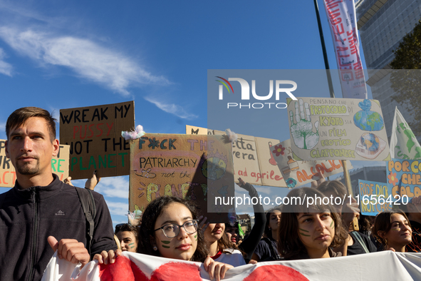 Protesters participate in the climate protest ''Fridays For Future'' in Turin, Italy, on October 11, 2024. The Fridays for the Future moveme...