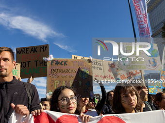 Protesters participate in the climate protest ''Fridays For Future'' in Turin, Italy, on October 11, 2024. The Fridays for the Future moveme...