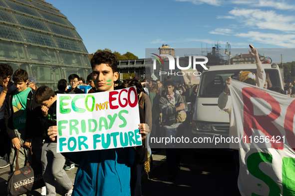 Protesters participate in the climate protest ''Fridays For Future'' in Turin, Italy, on October 11, 2024. The Fridays for the Future moveme...