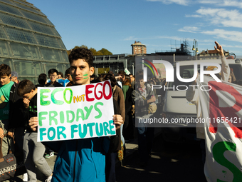 Protesters participate in the climate protest ''Fridays For Future'' in Turin, Italy, on October 11, 2024. The Fridays for the Future moveme...