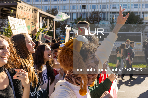 Protesters participate in the climate protest ''Fridays For Future'' in Turin, Italy, on October 11, 2024. The Fridays for the Future moveme...