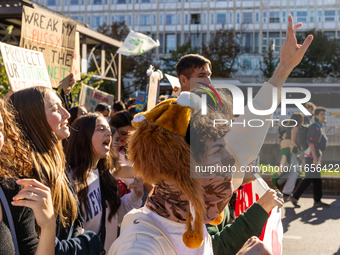 Protesters participate in the climate protest ''Fridays For Future'' in Turin, Italy, on October 11, 2024. The Fridays for the Future moveme...