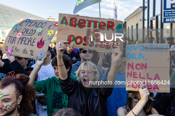 Protesters participate in the climate protest ''Fridays For Future'' in Turin, Italy, on October 11, 2024. The Fridays for the Future moveme...