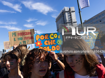 Protesters participate in the climate protest ''Fridays For Future'' in Turin, Italy, on October 11, 2024. The Fridays for the Future moveme...