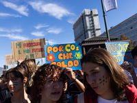 Protesters participate in the climate protest ''Fridays For Future'' in Turin, Italy, on October 11, 2024. The Fridays for the Future moveme...