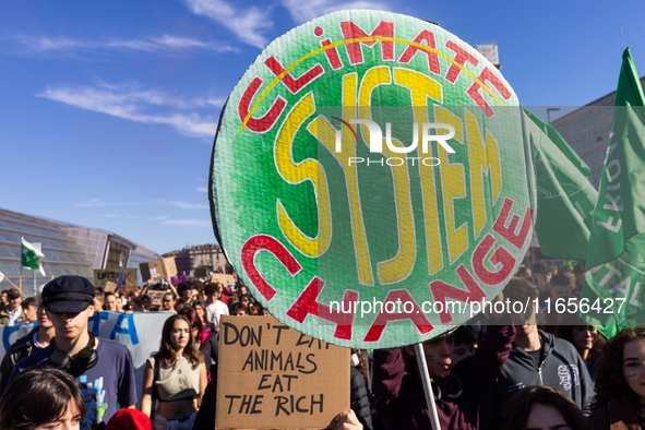 Protesters participate in the climate protest ''Fridays For Future'' in Turin, Italy, on October 11, 2024. The Fridays for the Future moveme...