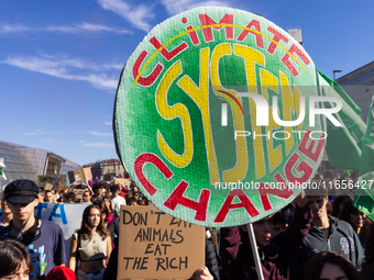 Protesters participate in the climate protest ''Fridays For Future'' in Turin, Italy, on October 11, 2024. The Fridays for the Future moveme...