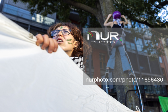 Protesters participate in the climate protest ''Fridays For Future'' in Turin, Italy, on October 11, 2024. The Fridays for the Future moveme...