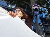 Protesters participate in the climate protest ''Fridays For Future'' in Turin, Italy, on October 11, 2024. The Fridays for the Future moveme...