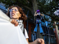 Protesters participate in the climate protest ''Fridays For Future'' in Turin, Italy, on October 11, 2024. The Fridays for the Future moveme...