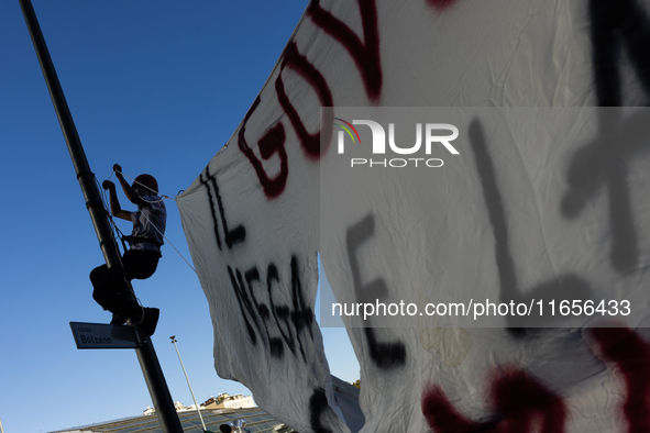 Protesters participate in the climate protest ''Fridays For Future'' in Turin, Italy, on October 11, 2024. The Fridays for the Future moveme...