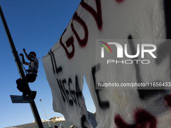 Protesters participate in the climate protest ''Fridays For Future'' in Turin, Italy, on October 11, 2024. The Fridays for the Future moveme...