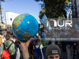 Protesters participate in the climate protest ''Fridays For Future'' in Turin, Italy, on October 11, 2024. The Fridays for the Future moveme...