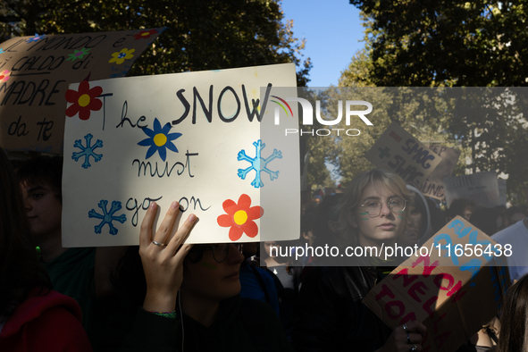 Protesters participate in the climate protest ''Fridays For Future'' in Turin, Italy, on October 11, 2024. The Fridays for the Future moveme...