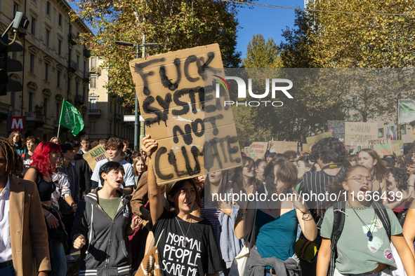 Protesters participate in the climate protest ''Fridays For Future'' in Turin, Italy, on October 11, 2024. The Fridays for the Future moveme...