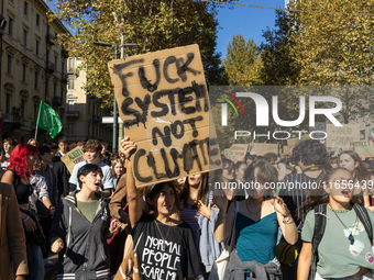 Protesters participate in the climate protest ''Fridays For Future'' in Turin, Italy, on October 11, 2024. The Fridays for the Future moveme...