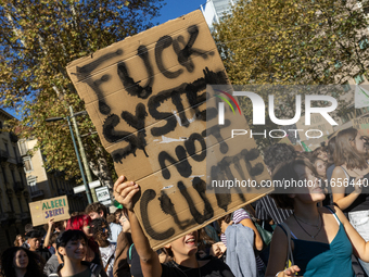 Protesters participate in the climate protest ''Fridays For Future'' in Turin, Italy, on October 11, 2024. The Fridays for the Future moveme...