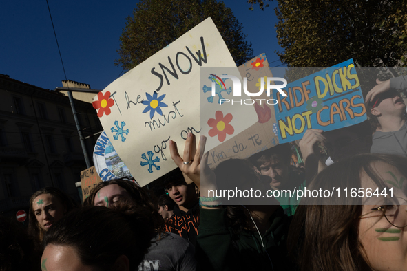 Protesters participate in the climate protest ''Fridays For Future'' in Turin, Italy, on October 11, 2024. The Fridays for the Future moveme...