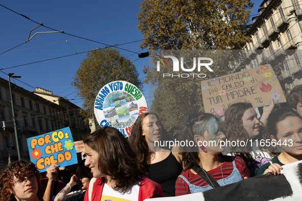 Protesters participate in the climate protest ''Fridays For Future'' in Turin, Italy, on October 11, 2024. The Fridays for the Future moveme...