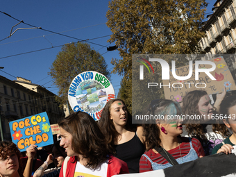 Protesters participate in the climate protest ''Fridays For Future'' in Turin, Italy, on October 11, 2024. The Fridays for the Future moveme...