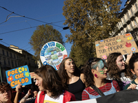 Protesters participate in the climate protest ''Fridays For Future'' in Turin, Italy, on October 11, 2024. The Fridays for the Future moveme...