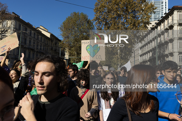 Protesters participate in the climate protest ''Fridays For Future'' in Turin, Italy, on October 11, 2024. The Fridays for the Future moveme...