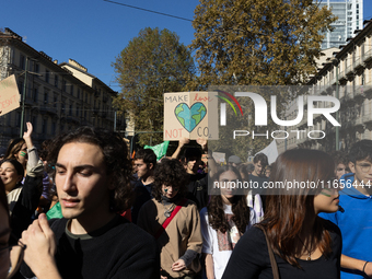 Protesters participate in the climate protest ''Fridays For Future'' in Turin, Italy, on October 11, 2024. The Fridays for the Future moveme...