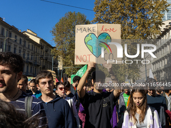 Protesters participate in the climate protest ''Fridays For Future'' in Turin, Italy, on October 11, 2024. The Fridays for the Future moveme...