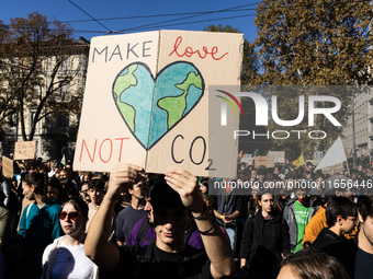 Protesters participate in the climate protest ''Fridays For Future'' in Turin, Italy, on October 11, 2024. The Fridays for the Future moveme...