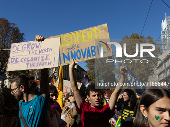 Protesters participate in the climate protest ''Fridays For Future'' in Turin, Italy, on October 11, 2024. The Fridays for the Future moveme...