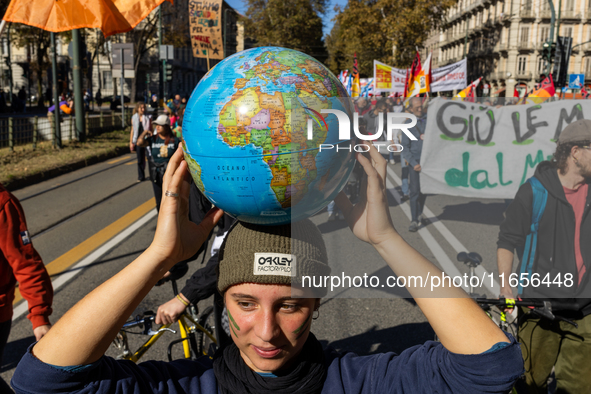 Protesters participate in the climate protest ''Fridays For Future'' in Turin, Italy, on October 11, 2024. The Fridays for the Future moveme...