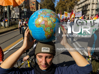 Protesters participate in the climate protest ''Fridays For Future'' in Turin, Italy, on October 11, 2024. The Fridays for the Future moveme...