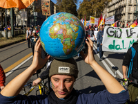 Protesters participate in the climate protest ''Fridays For Future'' in Turin, Italy, on October 11, 2024. The Fridays for the Future moveme...