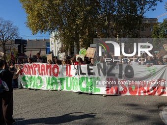 Protesters participate in the climate protest ''Fridays For Future'' in Turin, Italy, on October 11, 2024. The Fridays for the Future moveme...