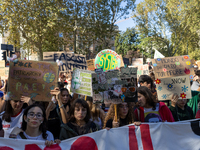 Protesters participate in the climate protest ''Fridays For Future'' in Turin, Italy, on October 11, 2024. The Fridays for the Future moveme...