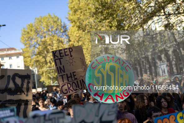 Protesters participate in the climate protest ''Fridays For Future'' in Turin, Italy, on October 11, 2024. The Fridays for the Future moveme...