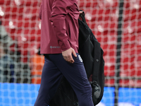 Lee Carsley, Interim Head Coach of England, participates in the pre-match warm-up during the UEFA Nations League Group 2 match between Engla...