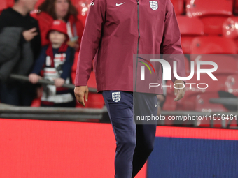 Joleon Lescott, interim coach of England, participates in the pre-match warm-up during the UEFA Nations League Group 2 match between England...