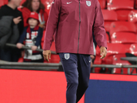 Joleon Lescott, interim coach of England, participates in the pre-match warm-up during the UEFA Nations League Group 2 match between England...