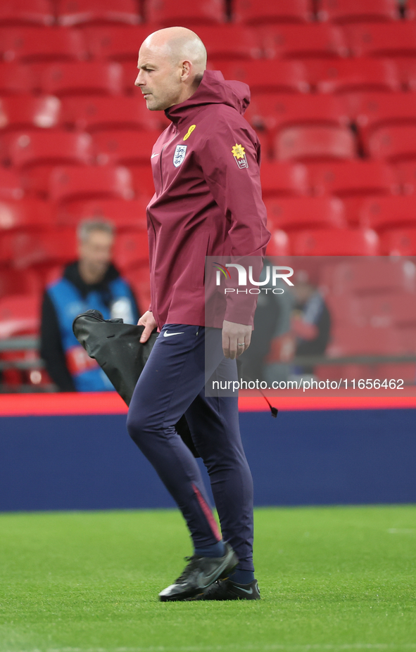 Lee Carsley, Interim Head Coach of England, participates in the pre-match warm-up during the UEFA Nations League Group 2 match between Engla...