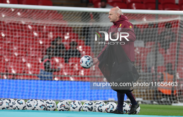 Lee Carsley, Interim Head Coach of England, participates in the pre-match warm-up during the UEFA Nations League Group 2 match between Engla...